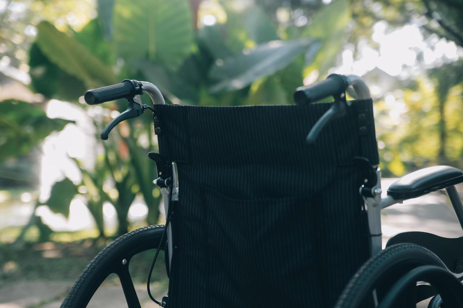 Single wheelchair parked in hospital hallway photo