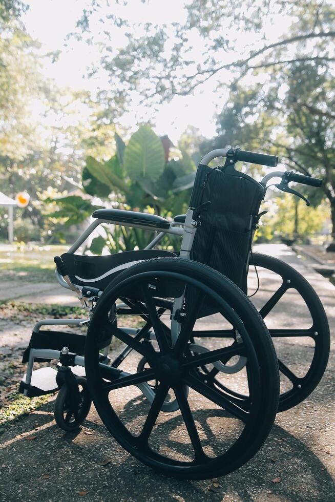 Single wheelchair parked in hospital hallway photo