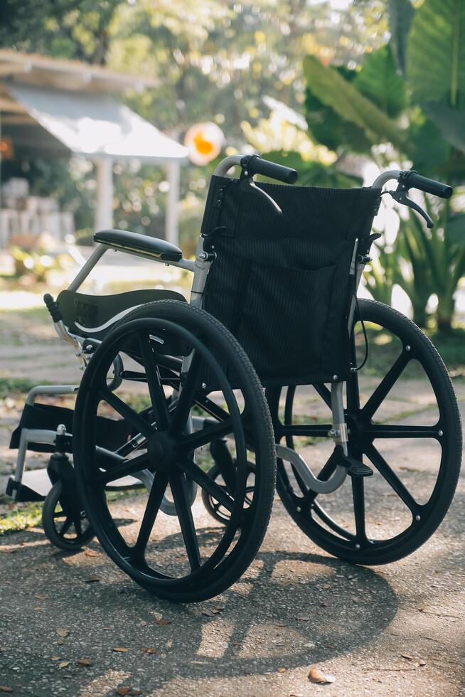 Single wheelchair parked in hospital hallway photo