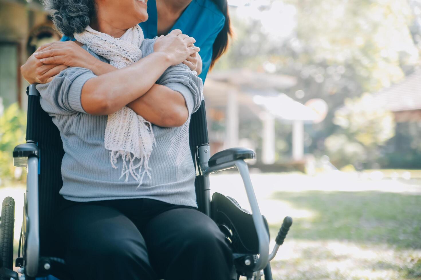 Young asian caretaker with 60s asia elderly woman consulting and encourage, take a history and recommend the right treatment to live happily in retirement, holding hands and encouraging photo