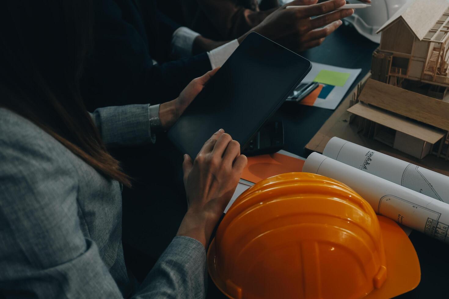 Engineer Teamwork Meeting, Drawing working on blueprint meeting for project working with partner on model building and engineering tools in working site, Construction and structure concept. photo