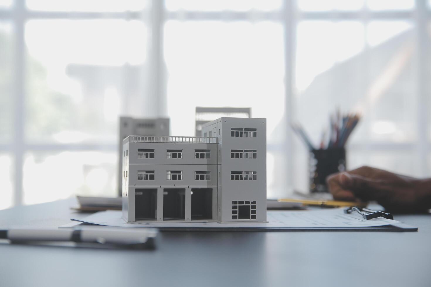 Real estate agent and Sales manager team analysis pricing of rental lease contract of sale purchase agreement, concerning mortgage loan offer for and house insurance. photo