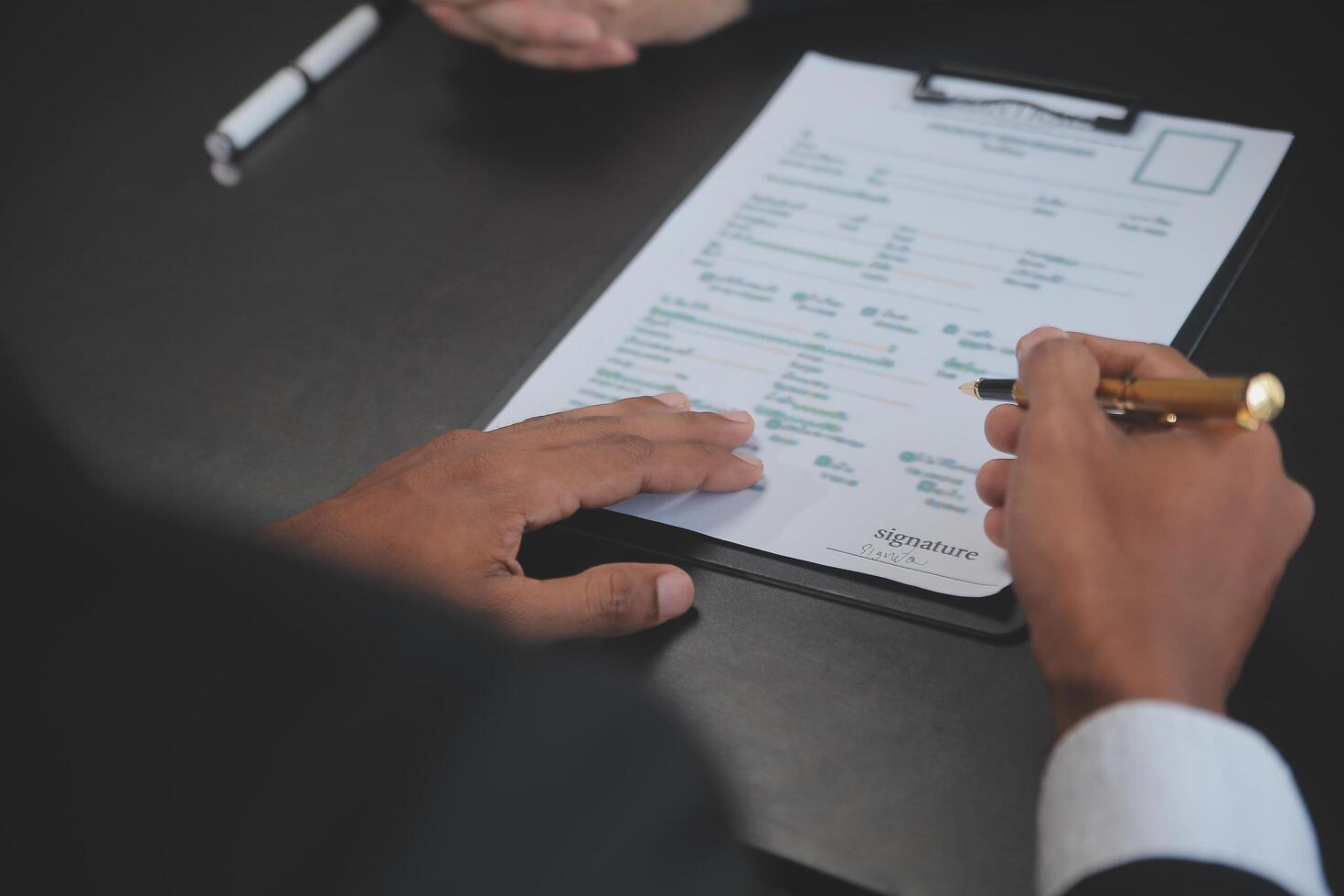 Real estate agent and Sales manager team analysis pricing of rental lease contract of sale purchase agreement, concerning mortgage loan offer for and house insurance. photo