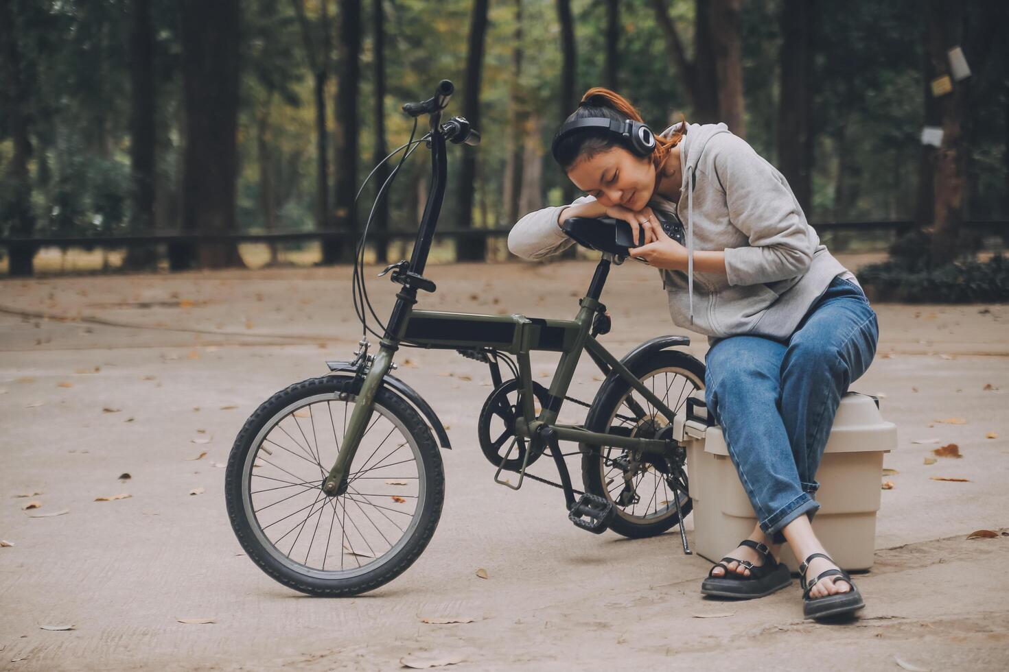 Happy Asian young woman walk and ride bicycle in park, street city her smiling using bike of transportation, ECO friendly, People lifestyle concept. photo