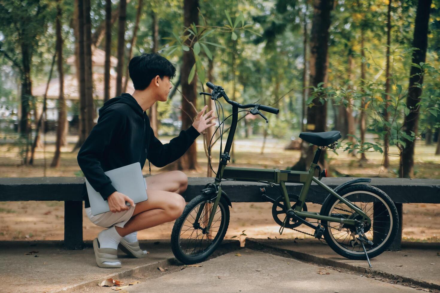 Handsome happy young man with bicycle on a city street, Active lifestyle, people concept photo