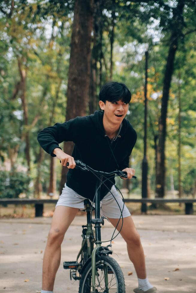 Handsome happy young man with bicycle on a city street, Active lifestyle, people concept photo