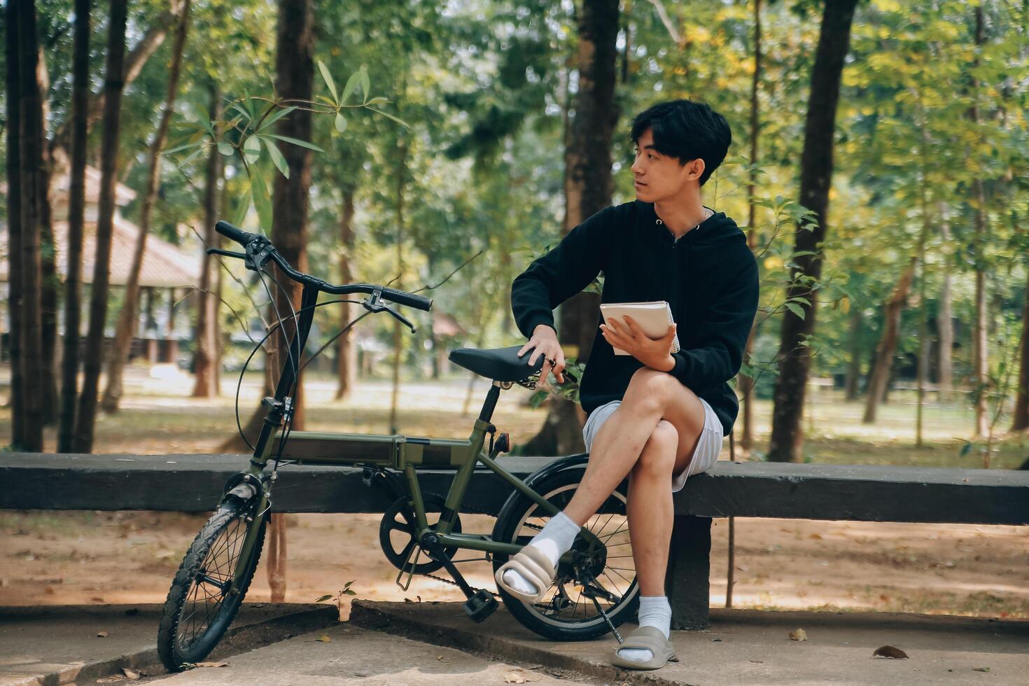 Handsome happy young man with bicycle on a city street, Active lifestyle, people concept photo