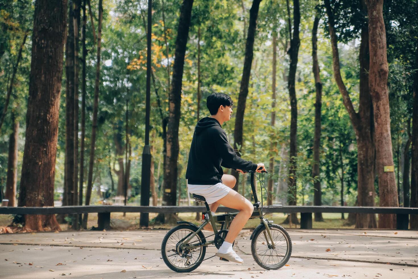 Handsome happy young man with bicycle on a city street, Active lifestyle, people concept photo