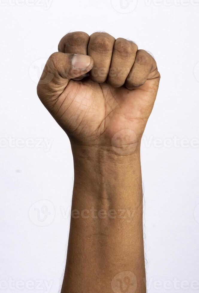 Holding fist up in the air isolated on white background photo