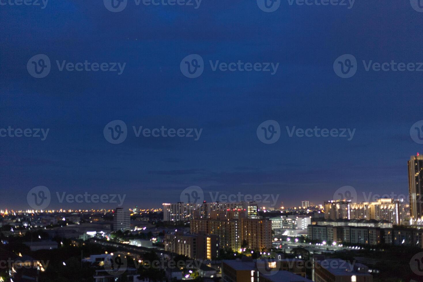 dark blue cloud with white light sky background and city light midnight evening time photo