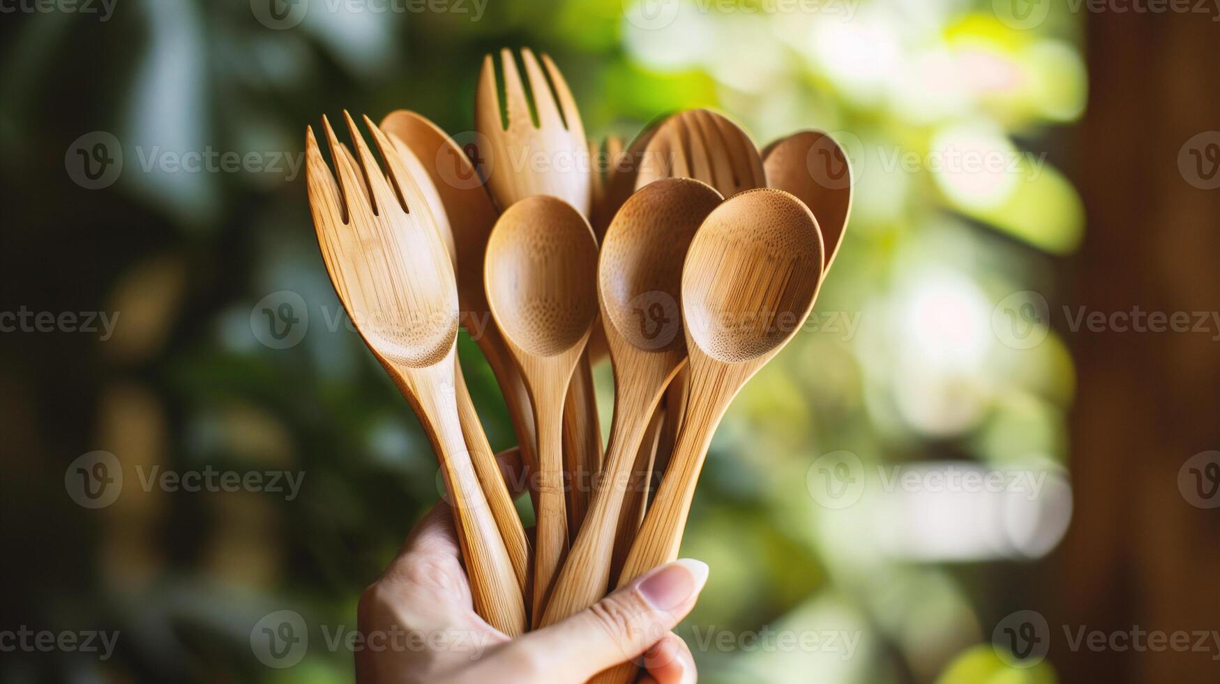 AI generated Hand holding wooden spoon and fork on green bokeh background. photo