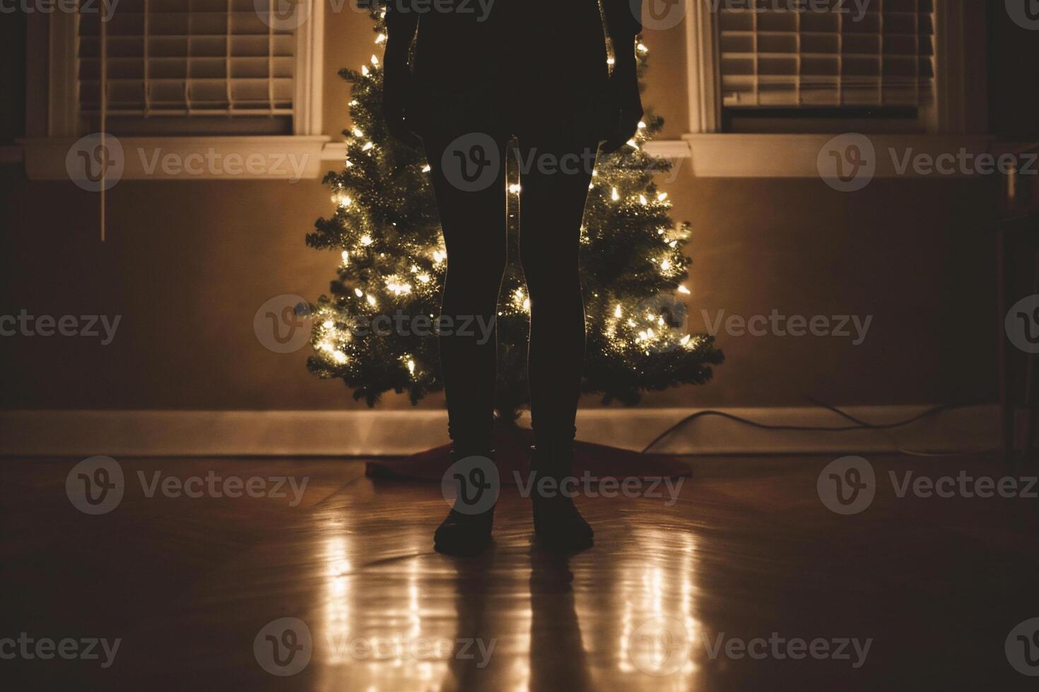 AI generated Silhouette of a girl in a room with a Christmas tree photo