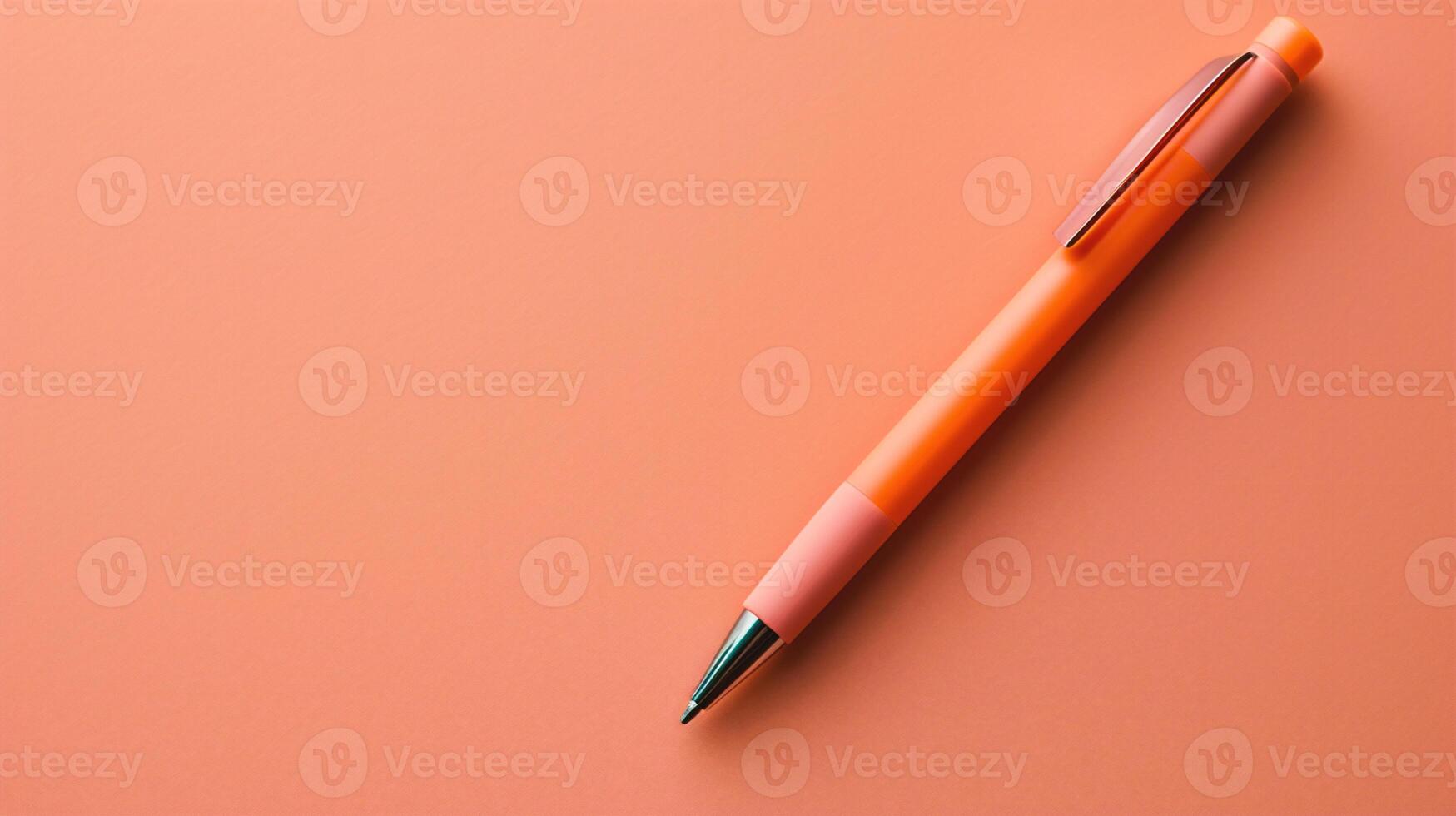 AI generated Orange pen on a pink background. Top view. Copy space. photo