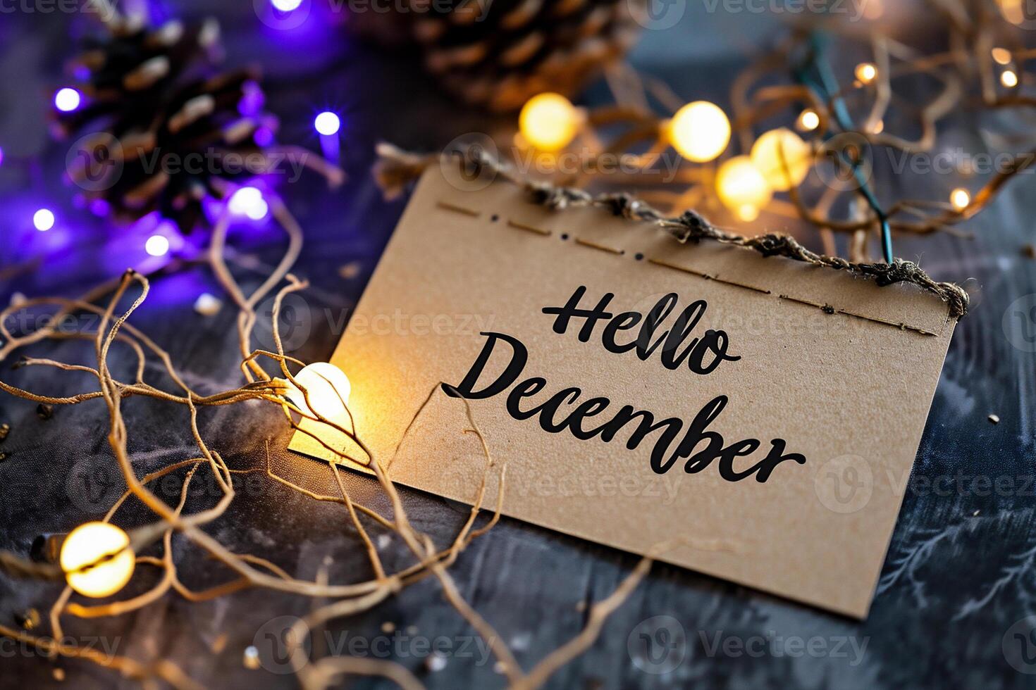 AI generated Hello December text on paper card with christmas lights on wooden background photo