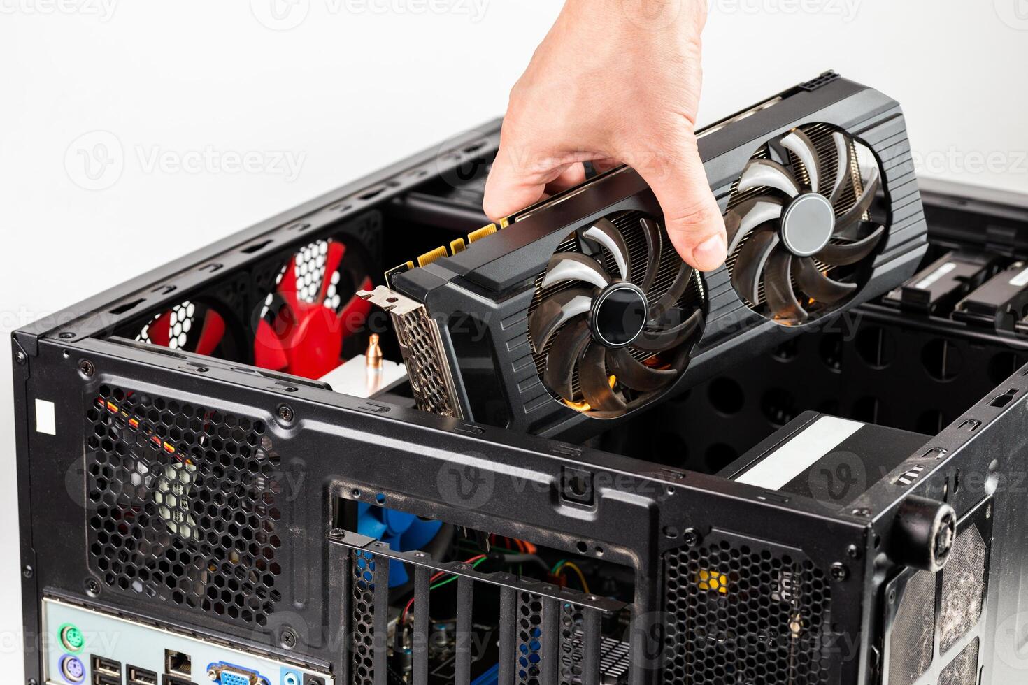 hand plugging a video card while maintenance personal computer hardware photo