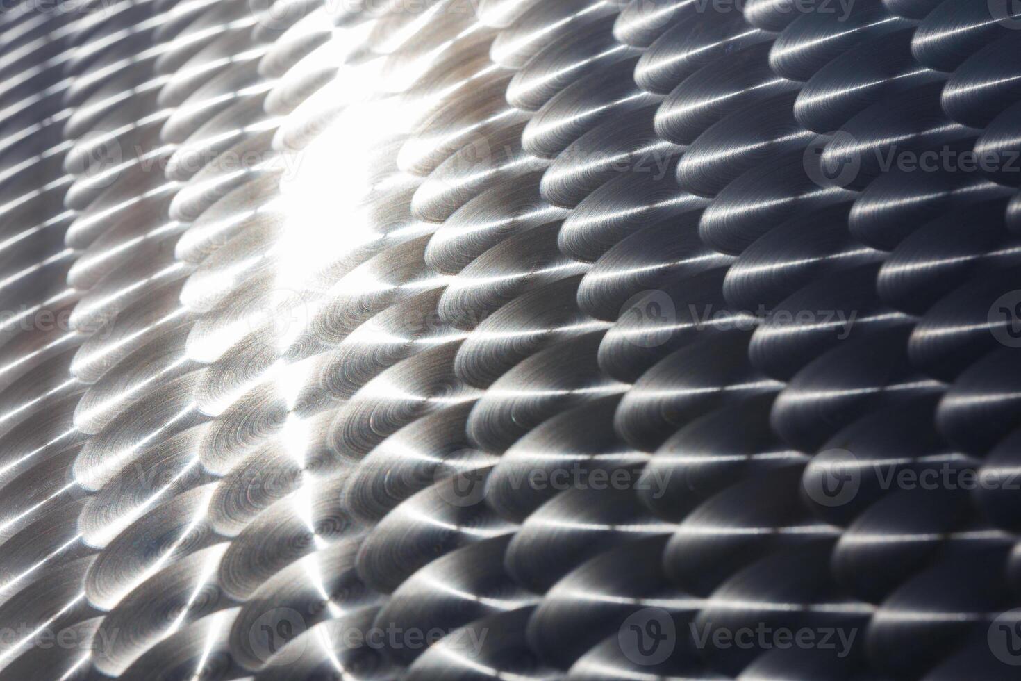ring polish stainless steel surface finishing full frame close-up background with selective focus photo