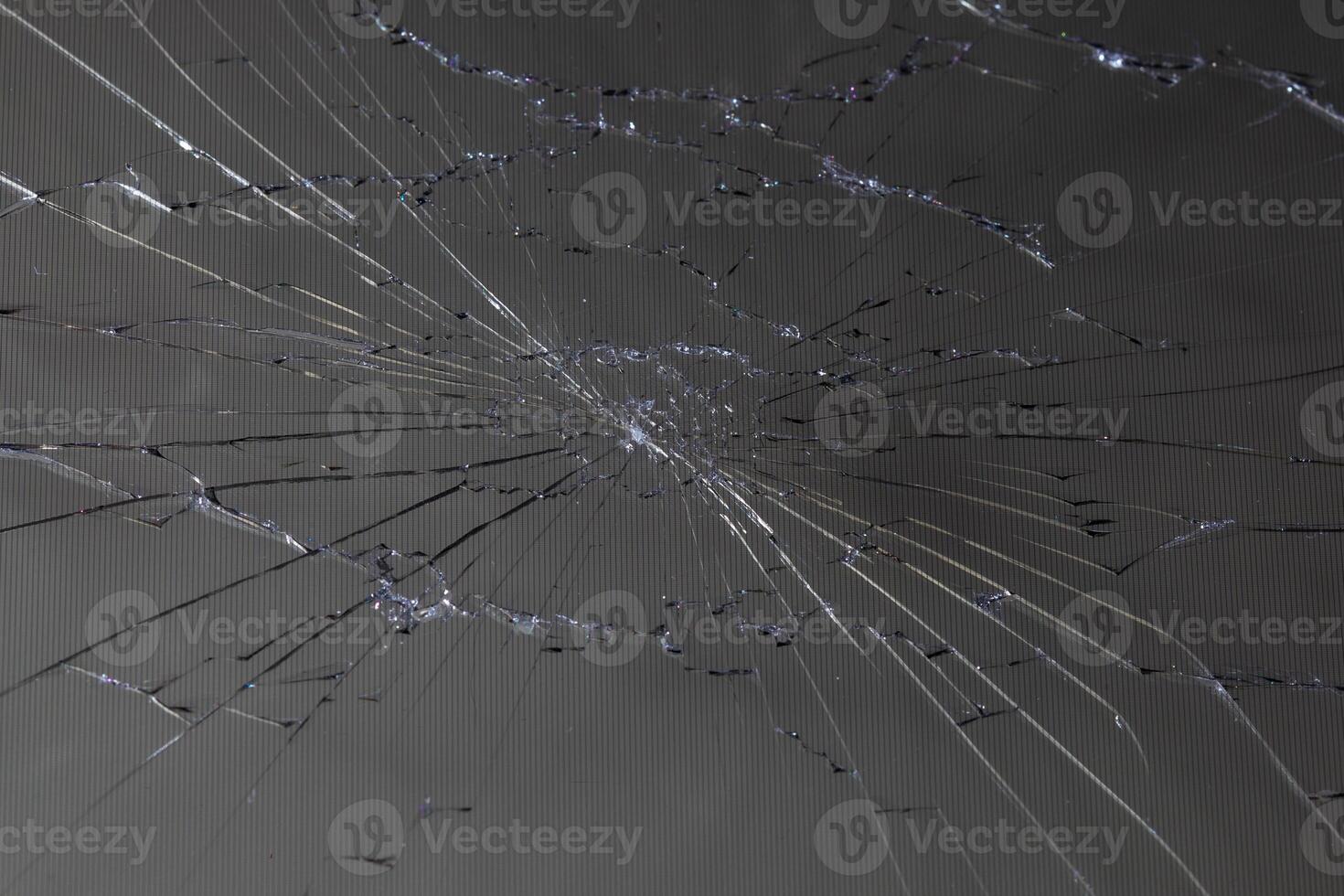 damaged LCD screen with cracks, full-frame background photo