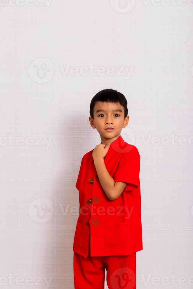 little boy fashion Smiling child in red chinese dress, style and fashion ideas for children. chinese new year photo