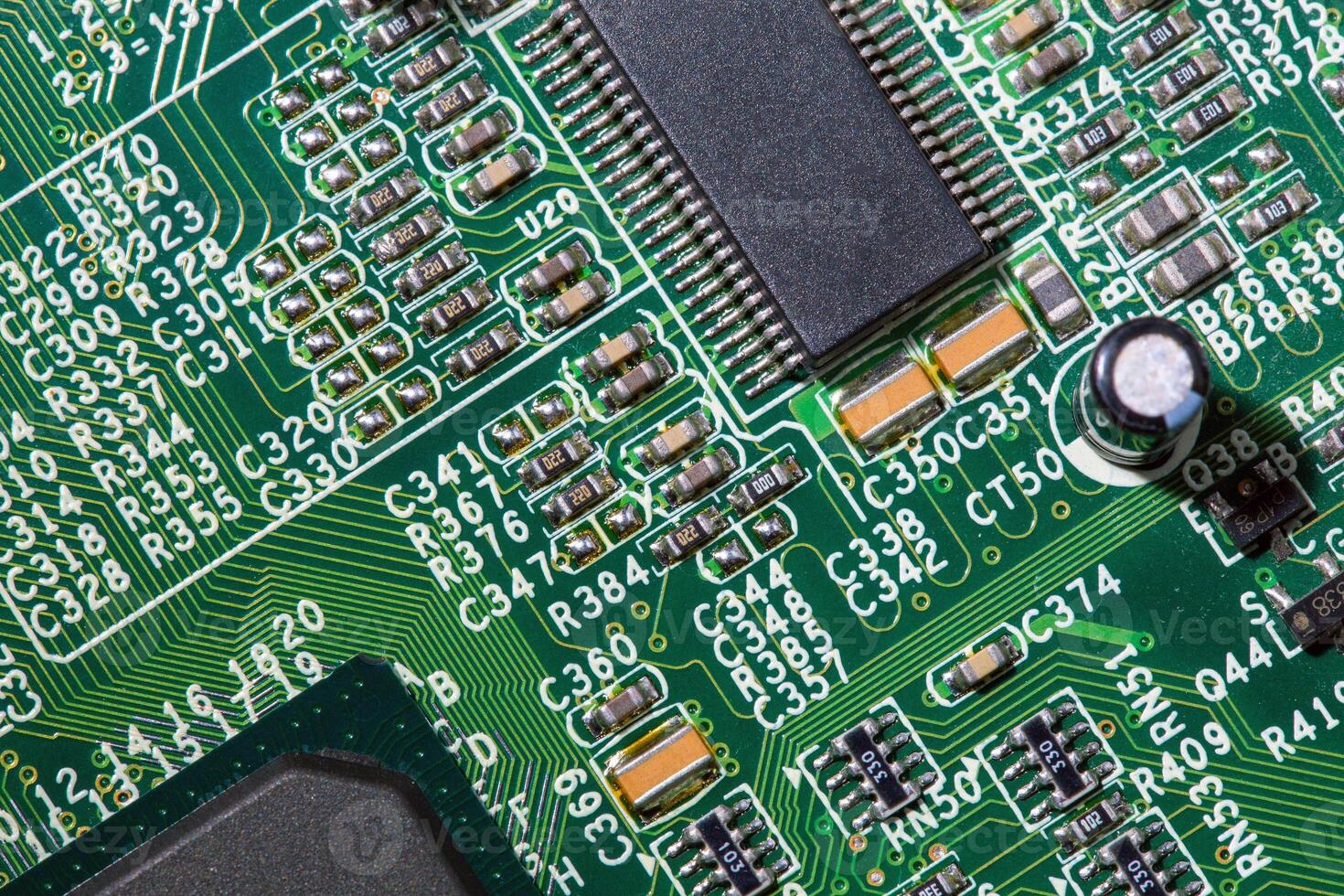 old digital circuit board with microprocessors and components, closeup full-frame macro background photo