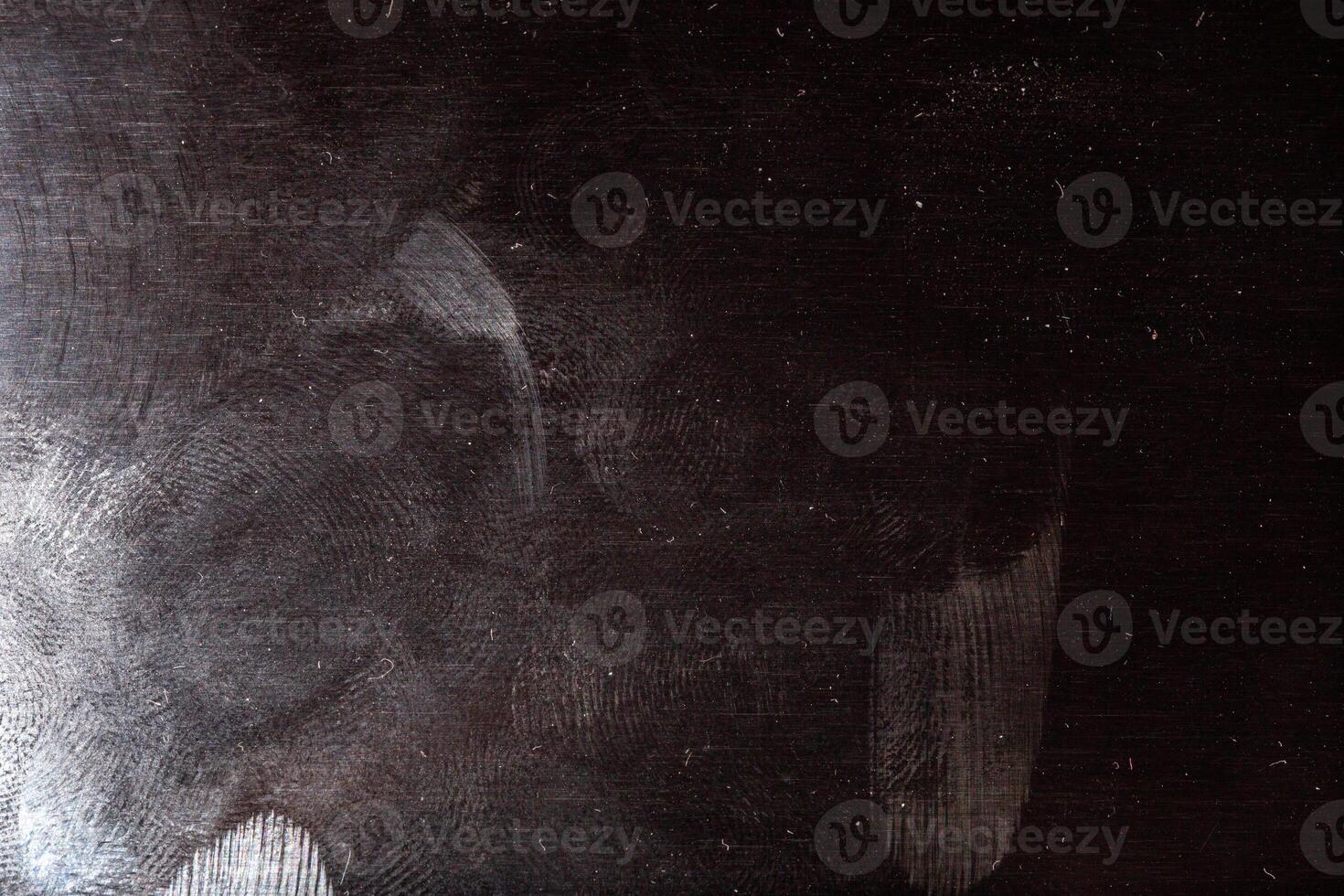 black surface with dust and oily fingerprints photo