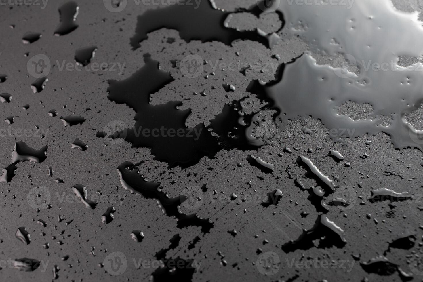 abstract background of wet black clean painted surface - close-up with selective focus photo