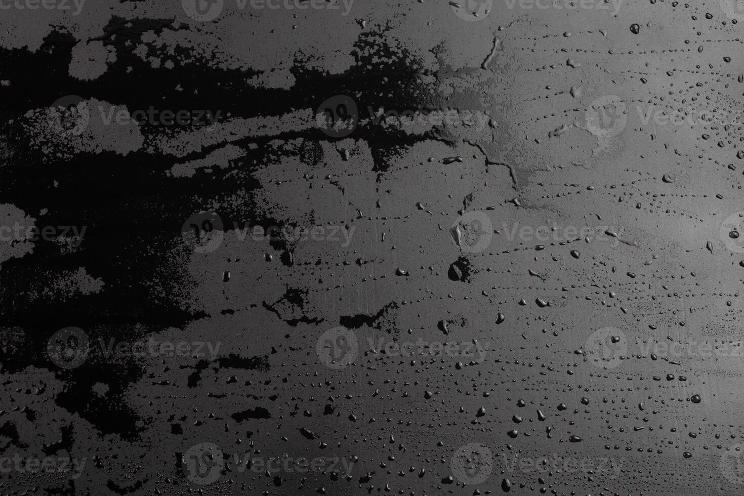 abstract background of wet black clean painted surface - close-up with selective focus photo