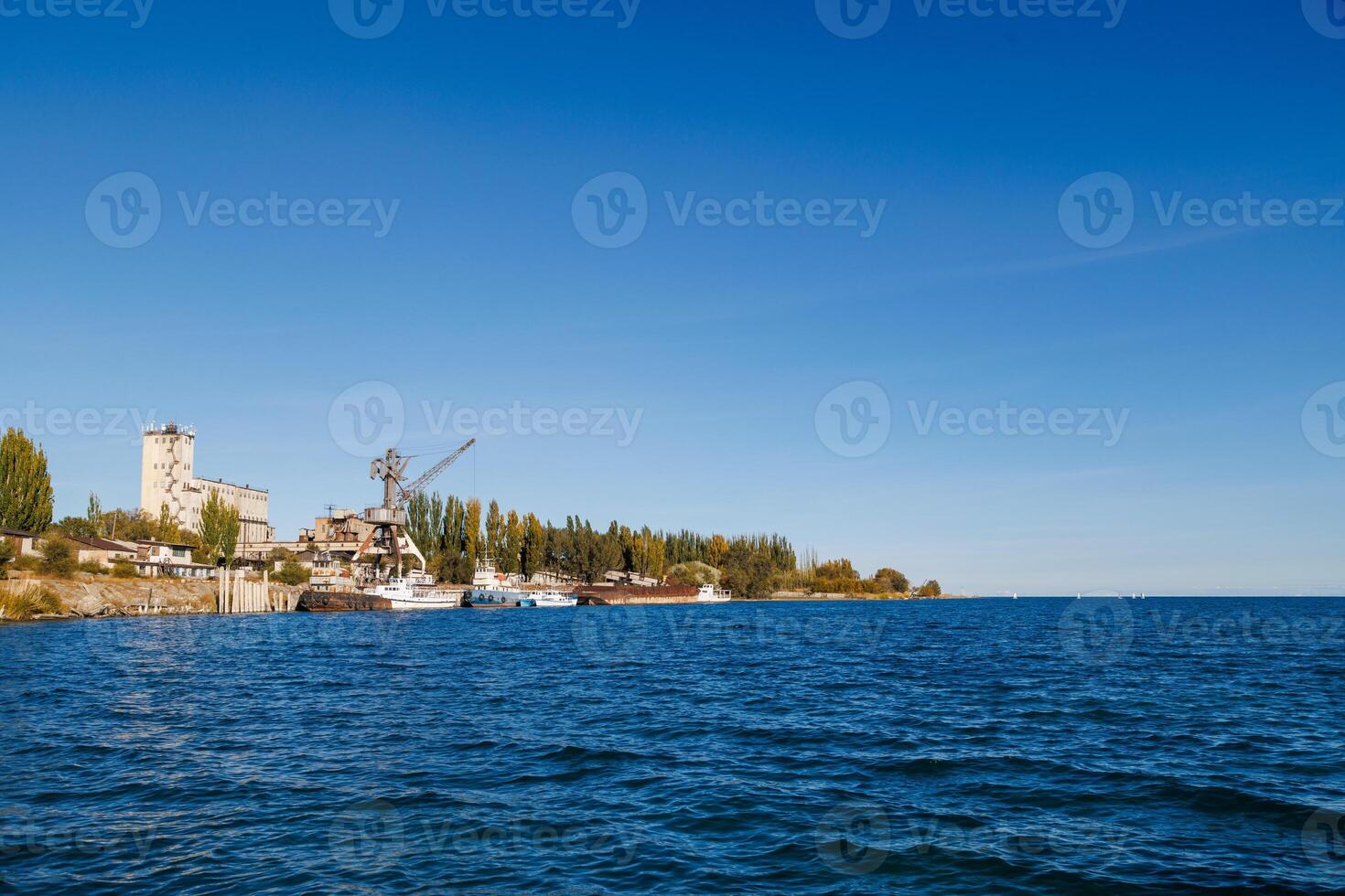 old abandoned soviet Port Balykchy on Issyk-Kul lake at sunny autumn afternoon photo