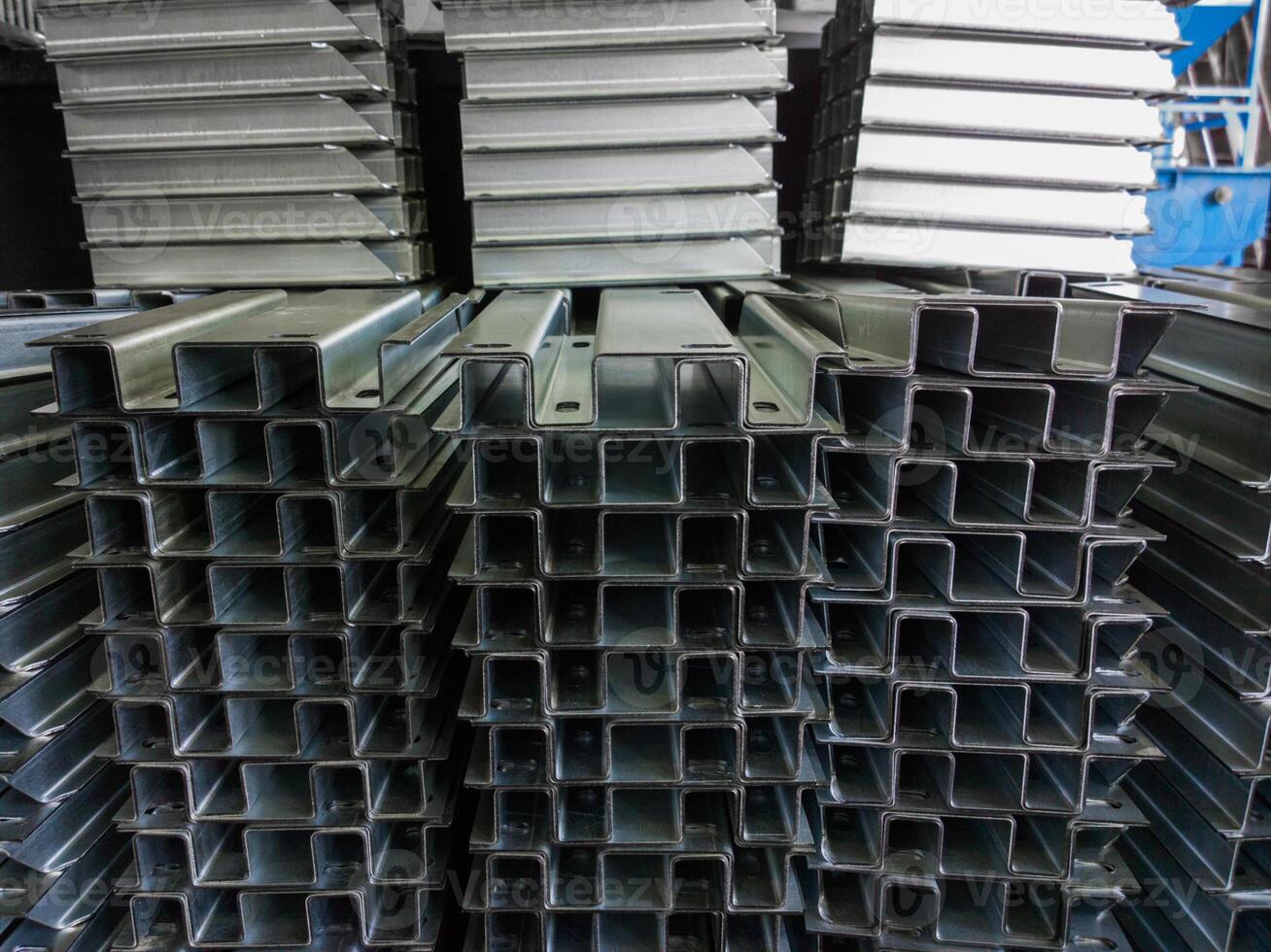 full frame view on stacks of profile bent sheet metal parts photo