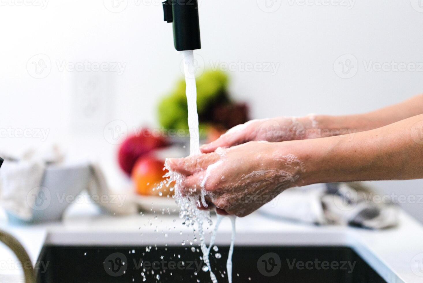 Hands wash procedure, cleaning hands with soap from viruses and contamination. Wash hands before dinner photo