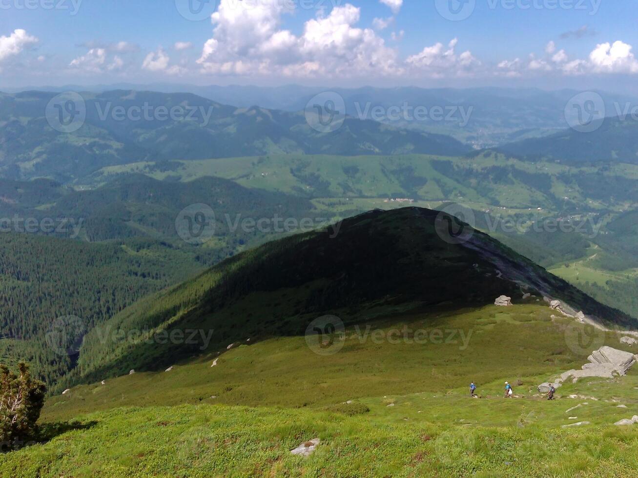 Tourists in the mountains photo