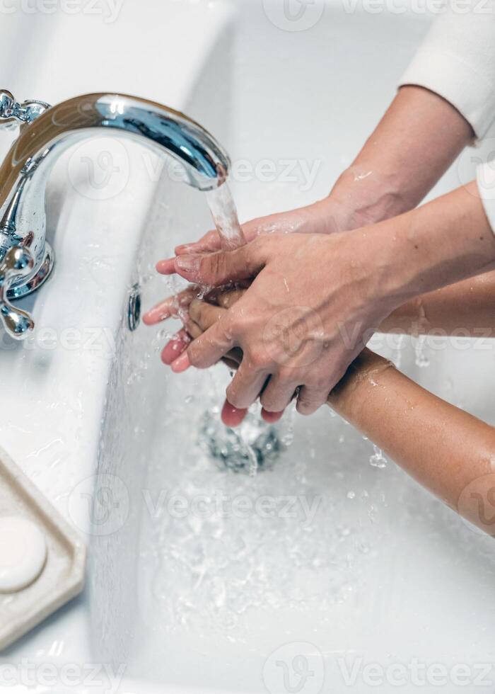 Hands wash procedure, cleaning hands with soap from viruses and contamination. Wash hands before dinner photo