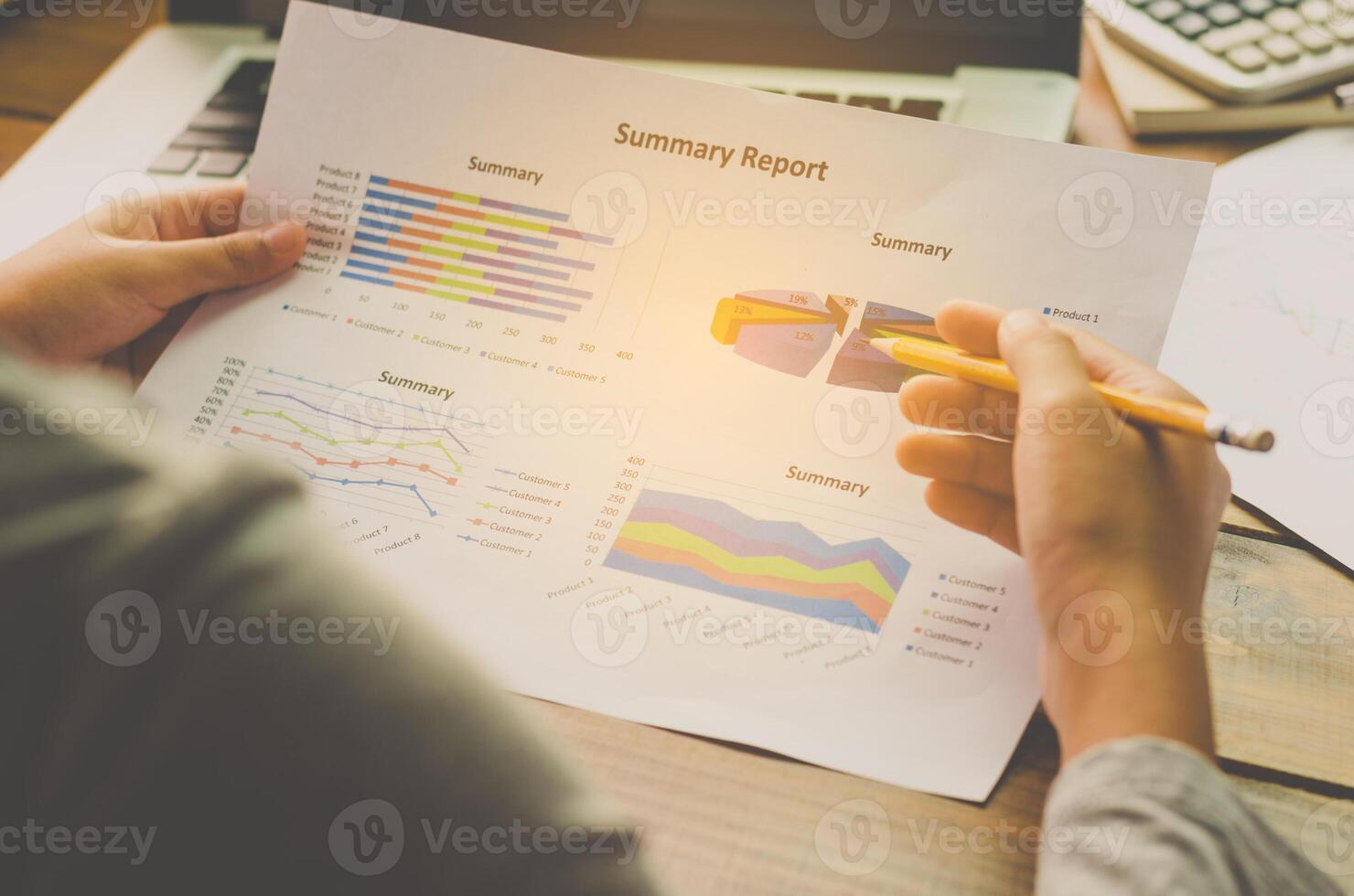 Business people using a laptop and report finance for meeting in office photo