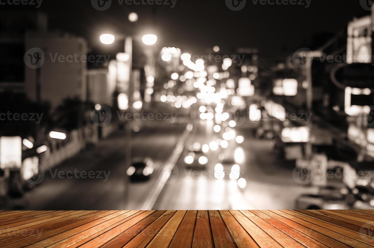 Wooden plank and blur cars traffic on urban street tone vintage photo
