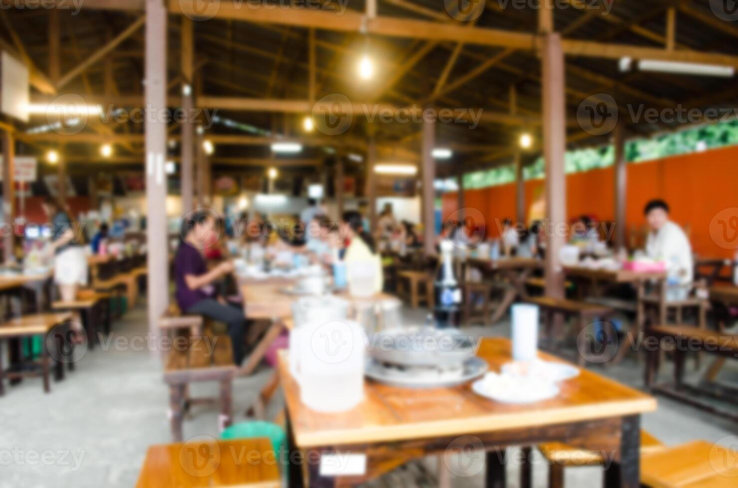 Blur restaurant with customers to access services. photo