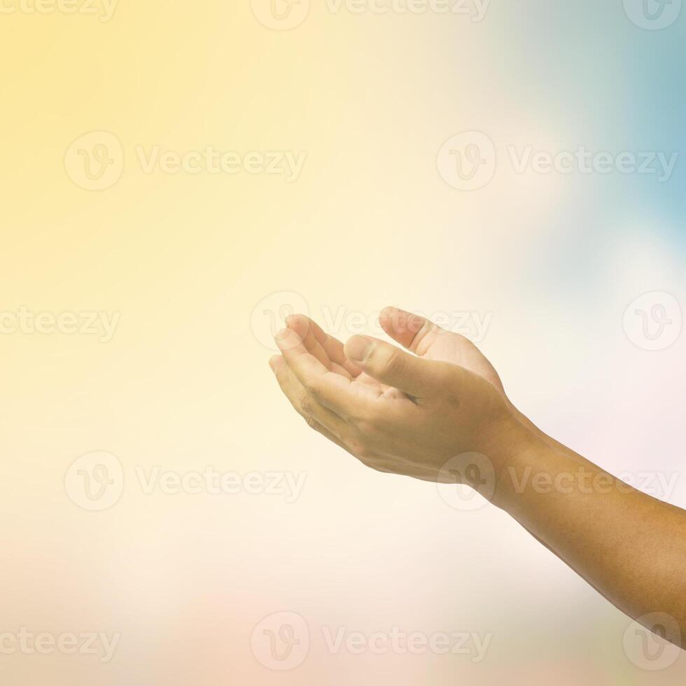 open hand on blurred abstract nature background - concept help photo