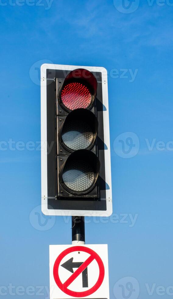 Traffic lights against sky backgrounds photo