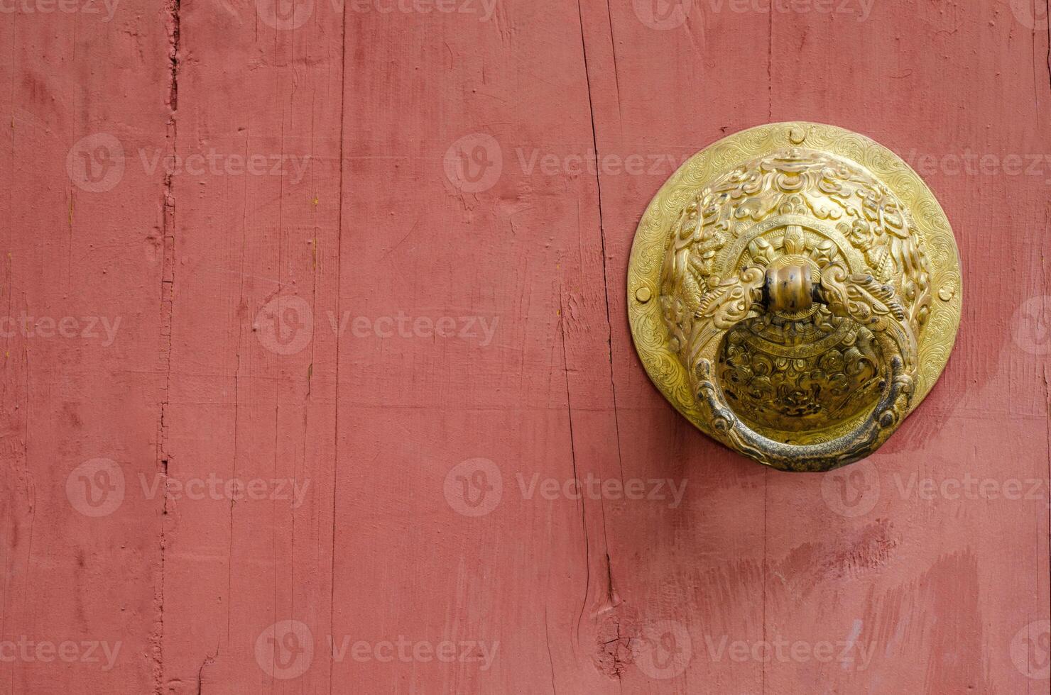 Chinese red door and knocker in gold to symbolize. photo