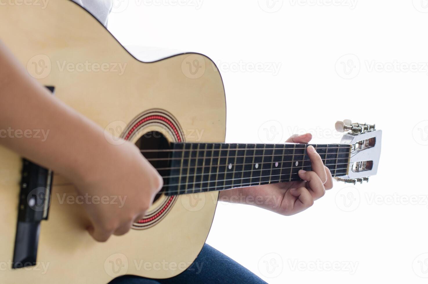 Girl playing guitar - Focus hand. photo