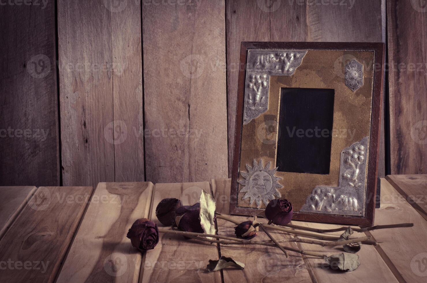 Still life picture frames, vases, dried rose notebook concept frequent memories. photo
