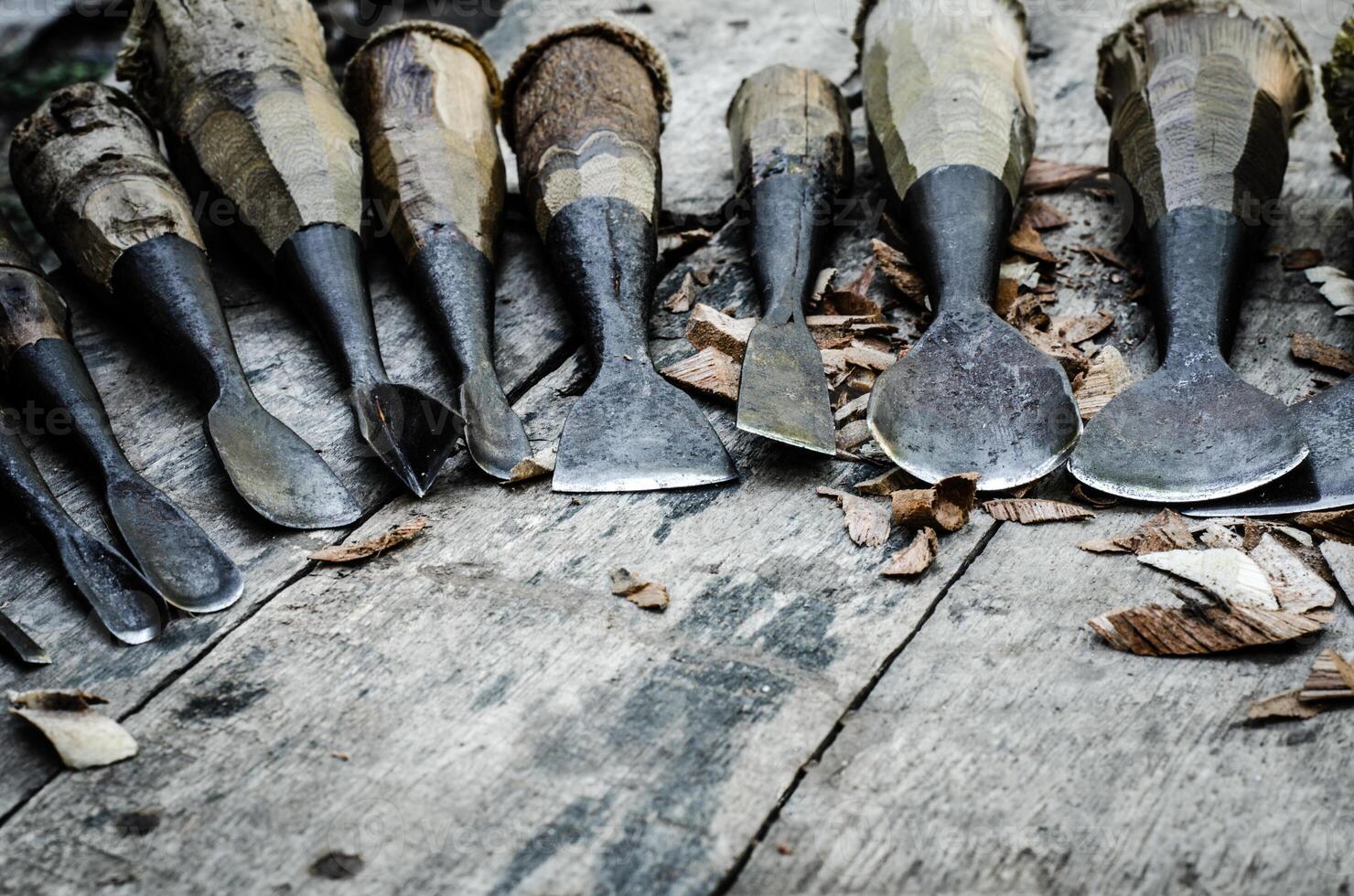 wood carving tools on wooden background photo