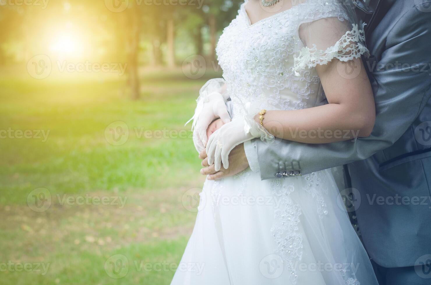 Weding in park with golden light in the morning photo