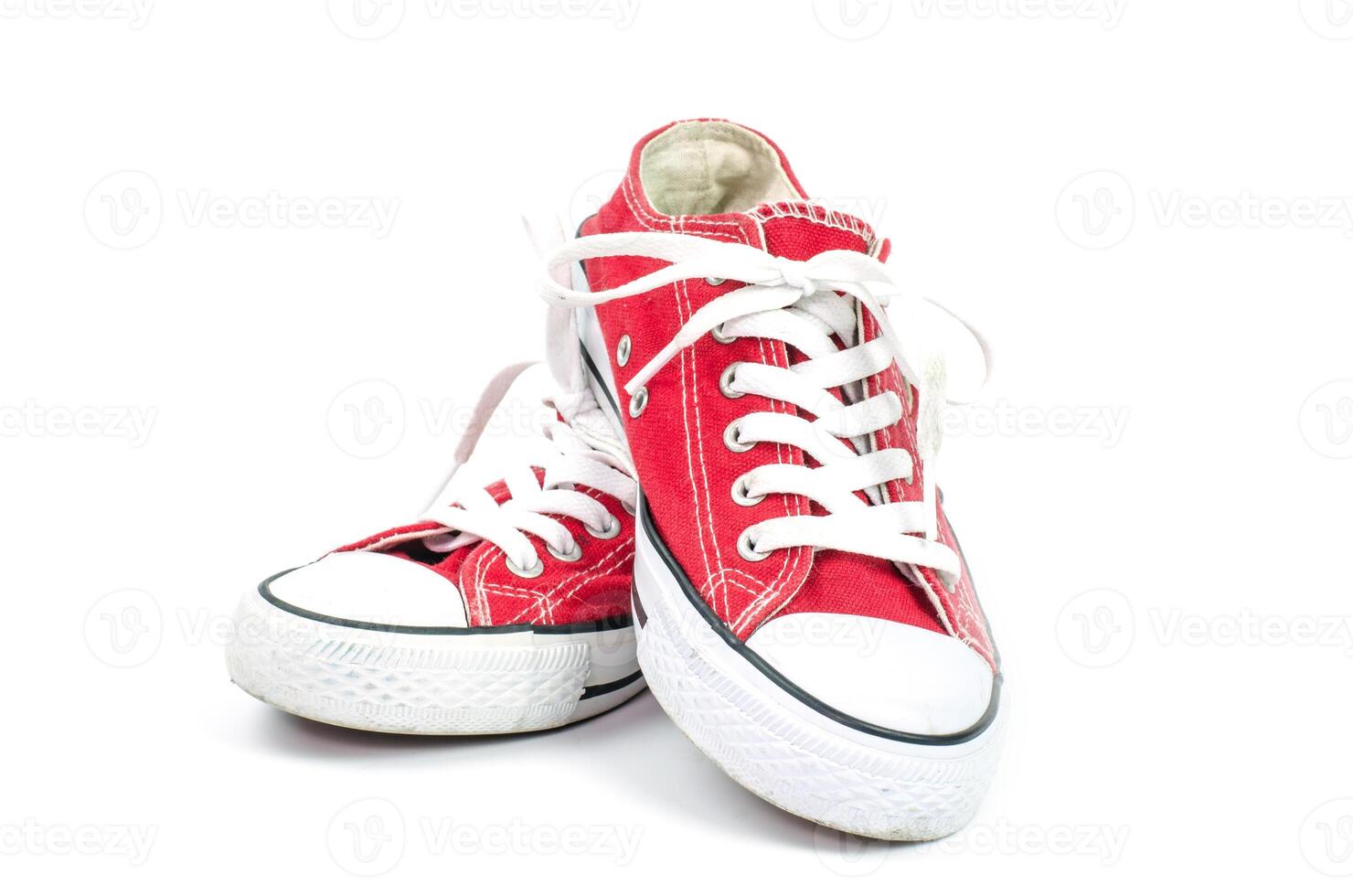 Red sneakers on a white background. photo