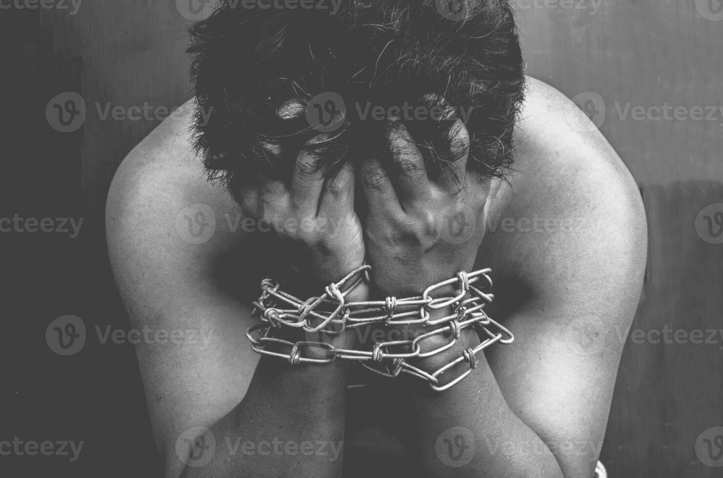 male prisoners are being Interpreting at the wrist chains are strain - tone black and white photo