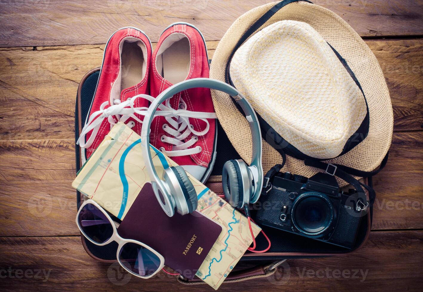 Travel accessories and costume on luggage prepare for trip photo