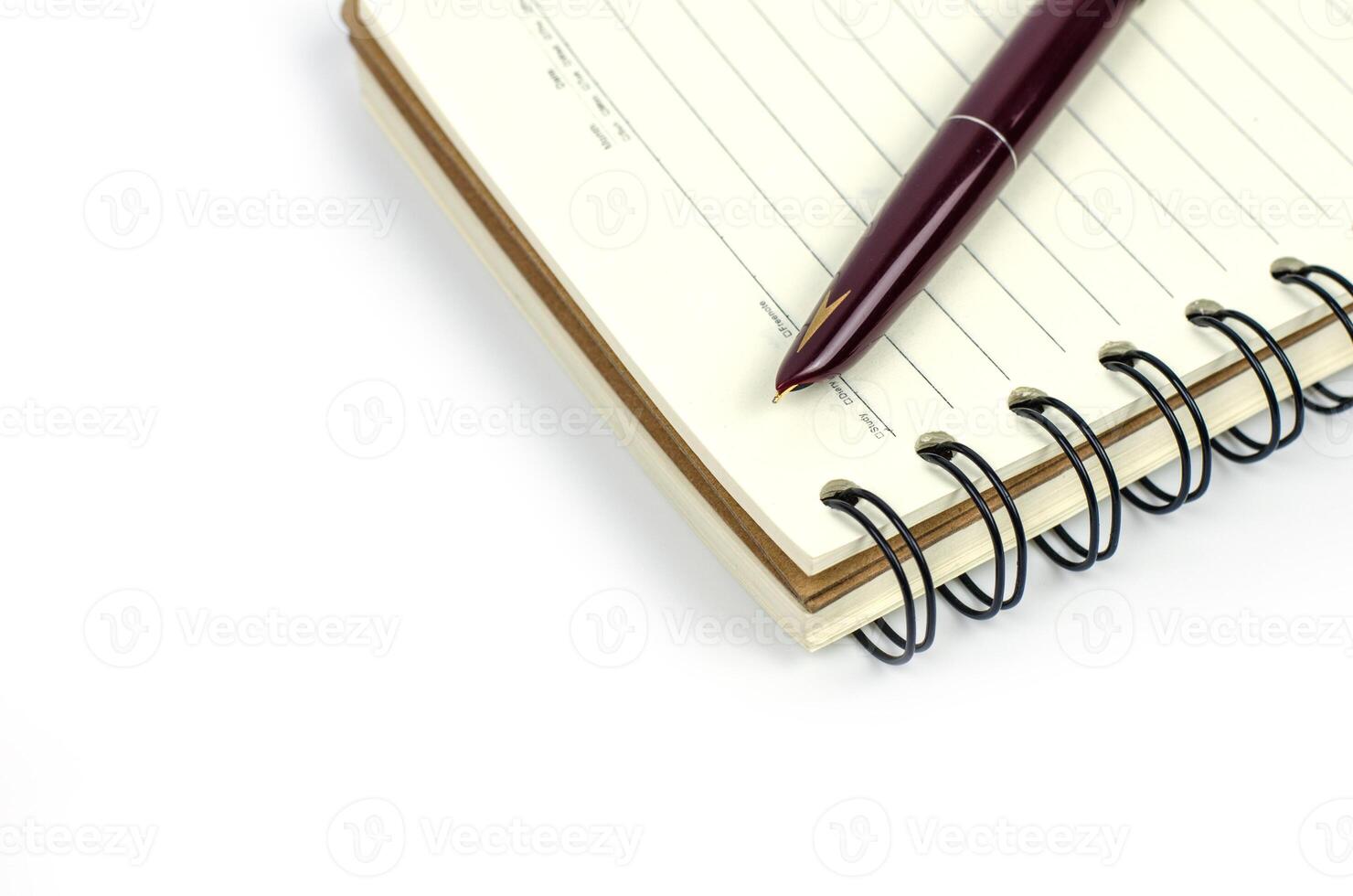 blank notebook with pencil on white background photo