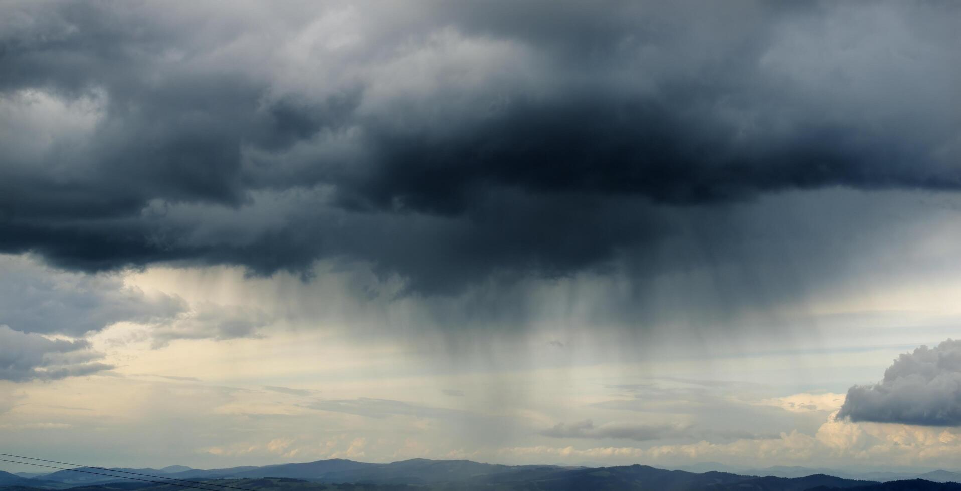 Thunderstorm coming and clouds raining photo