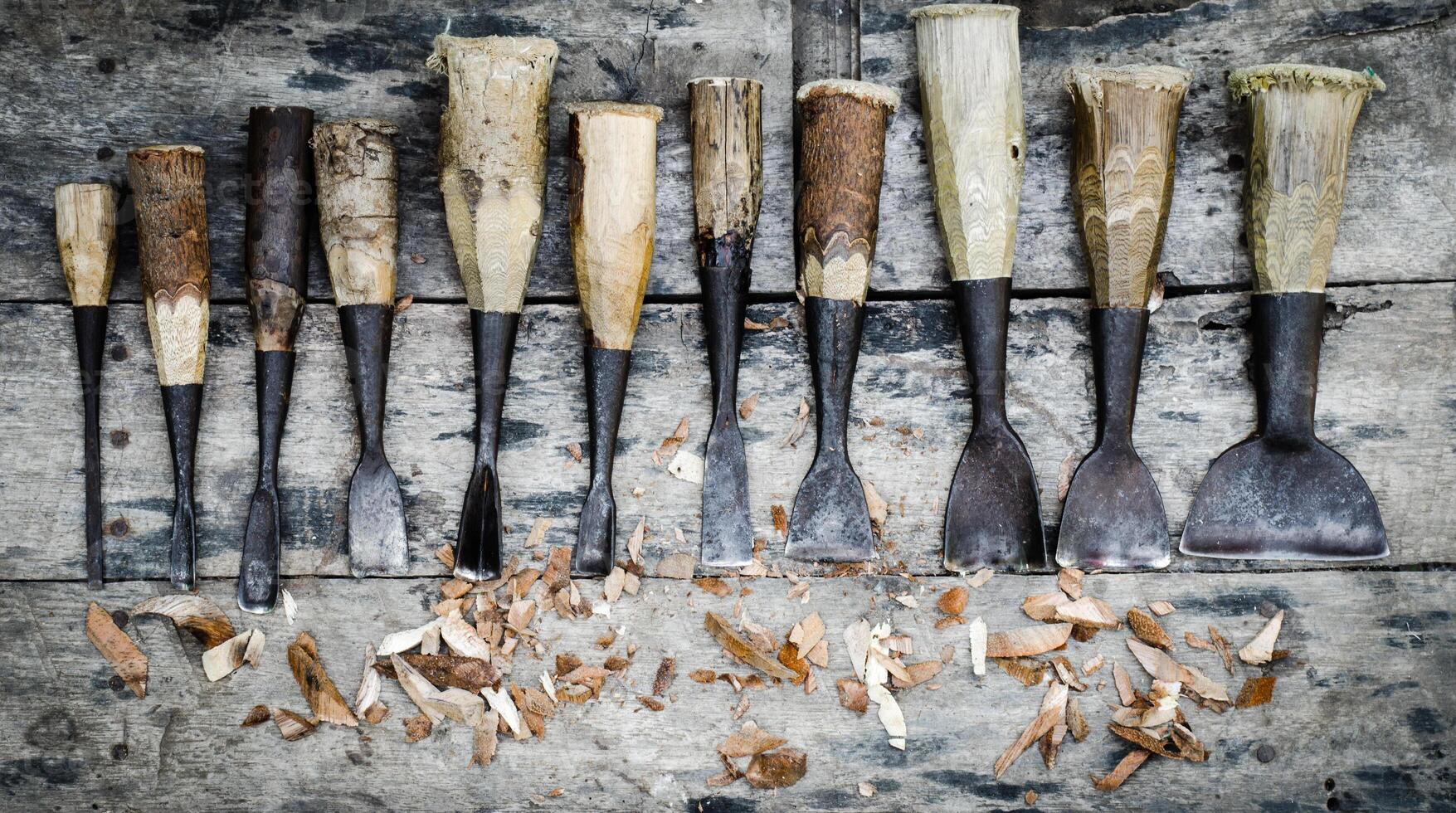 wood carving tools on wooden background photo