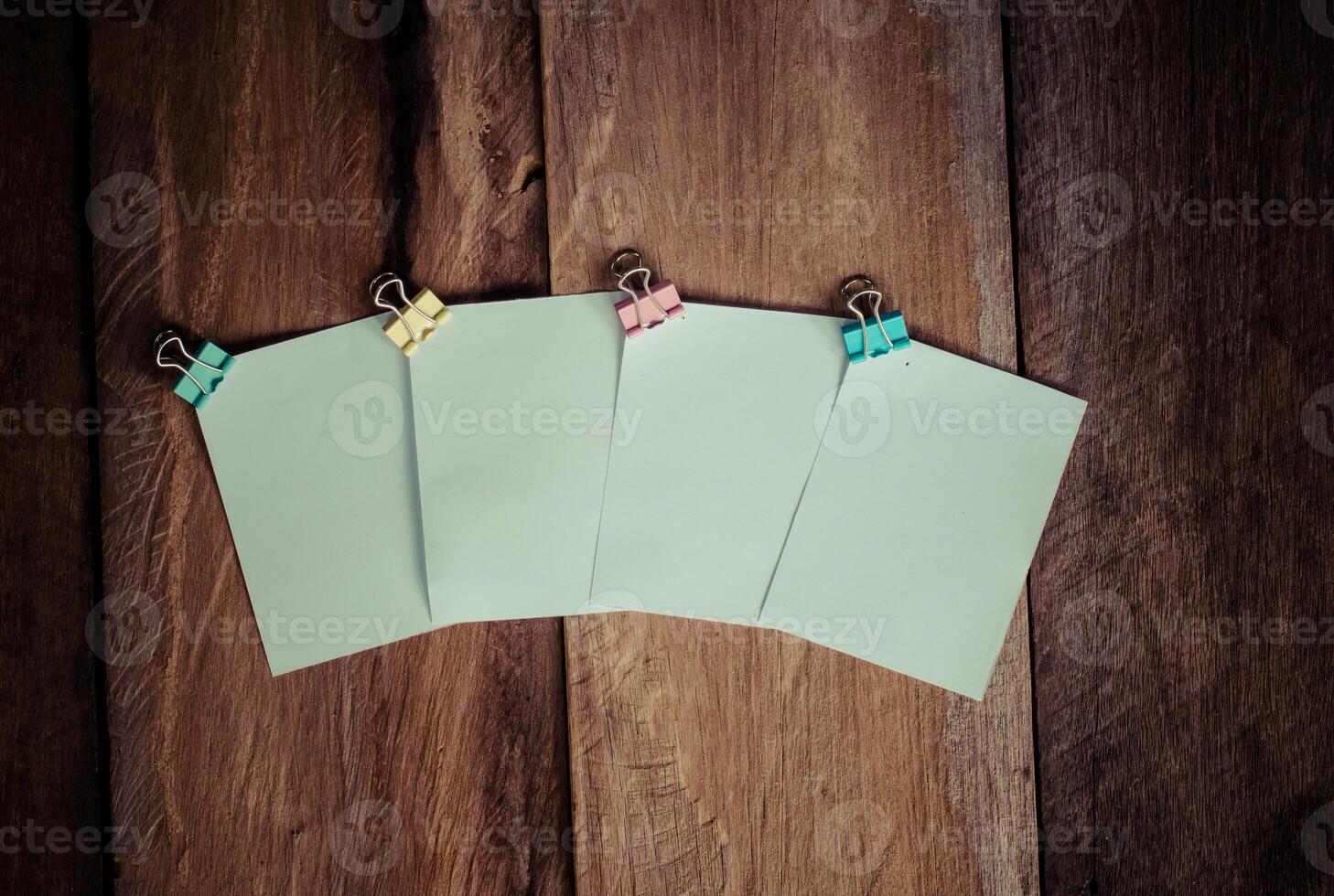 paper note on wooden background photo