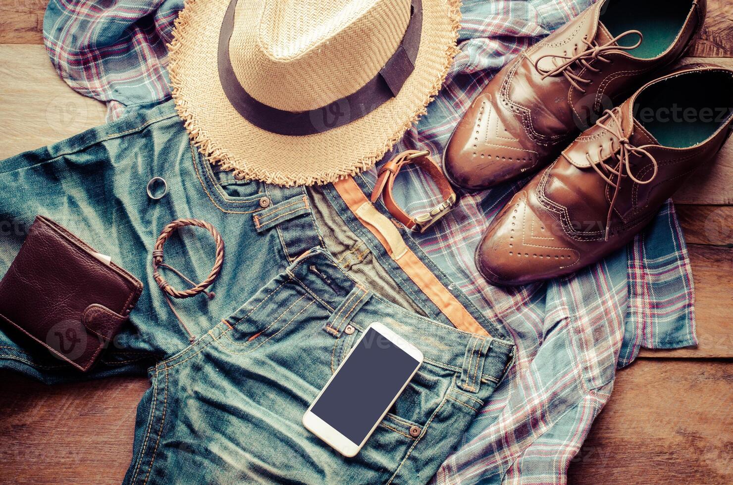 clothing for men, placed on a wooden floor. photo