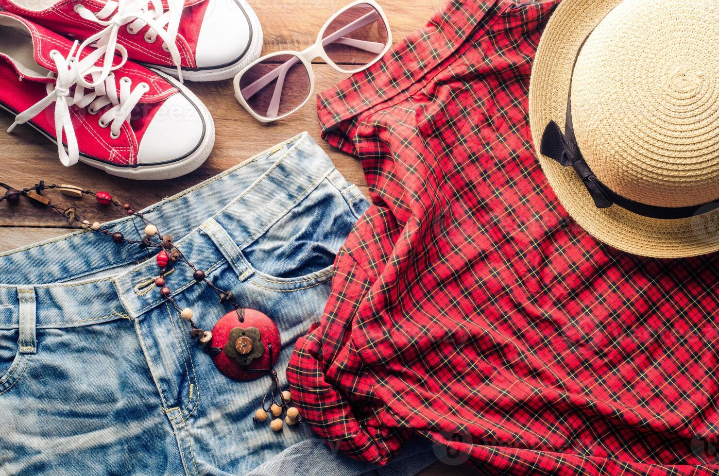 Clothing and accessories for women with summer on wood floor photo